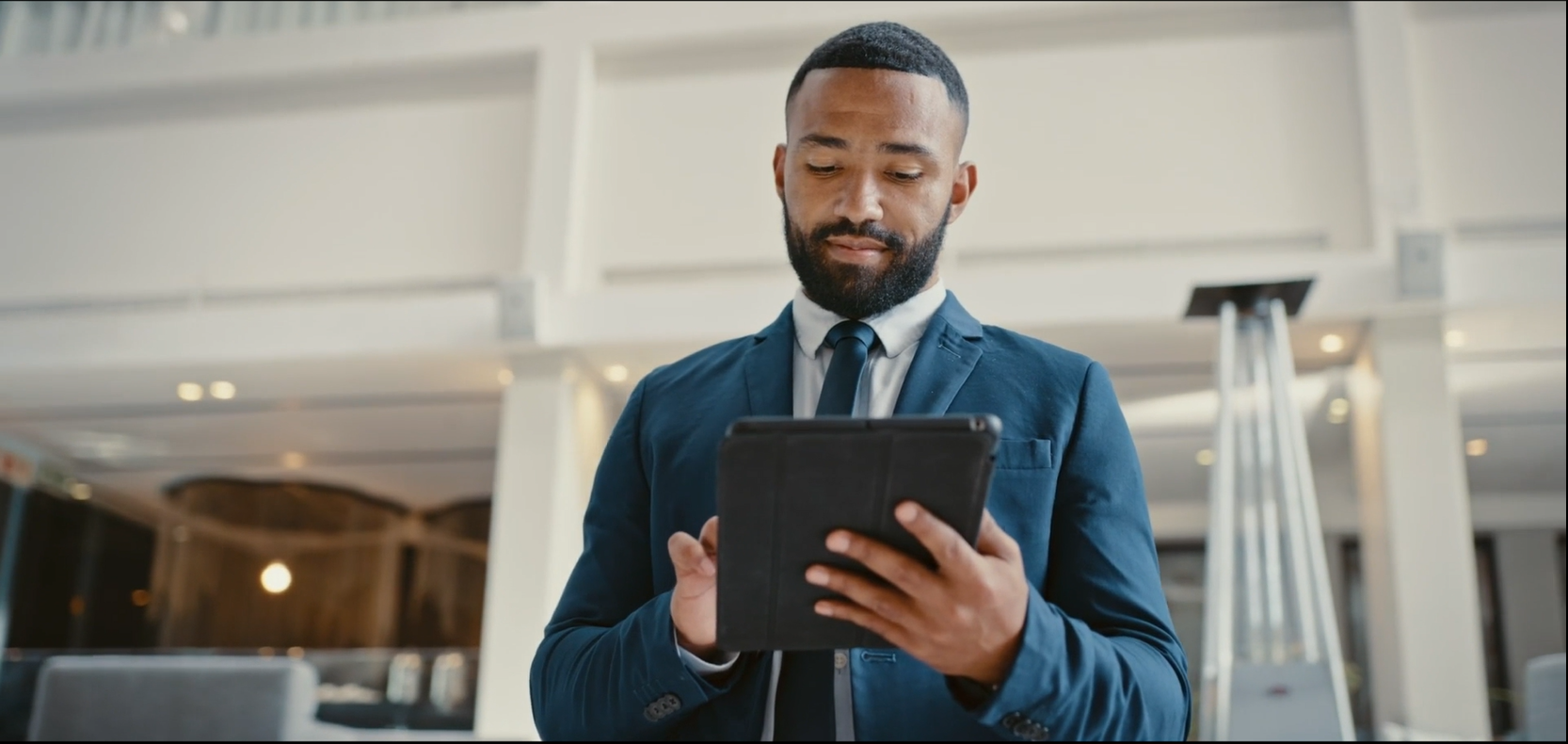 man holding a tablet